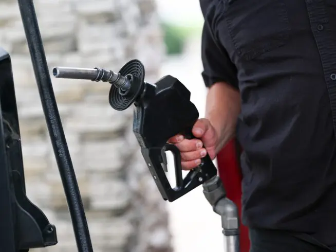 A driver fills their gas tank with fuel at a gas station, Sunday, May 10, 2026, in Houston.