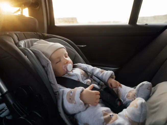 Baby sleeping in an infant car seat